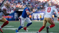 New York Giants quarterback Jaxson Dart (6) scrambles with the football during a week 9 game between New York Giants and San Francisco 49ers at MetLife Stadium on Sunday, Nov. 2, 2025.