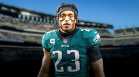 Jaire Alexander in an Eagles uniform with the number 23 on it in front of Lincoln Financial Field.