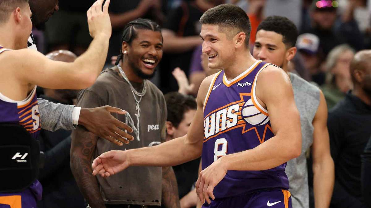 Phoenix Suns guard Grayson Allen (8) celebrates with teammates after being pulled from the game after setting the franchise record for three pointers in a game against the New Orleans Pelicans in the second half at the Mortgage Matchup Center.