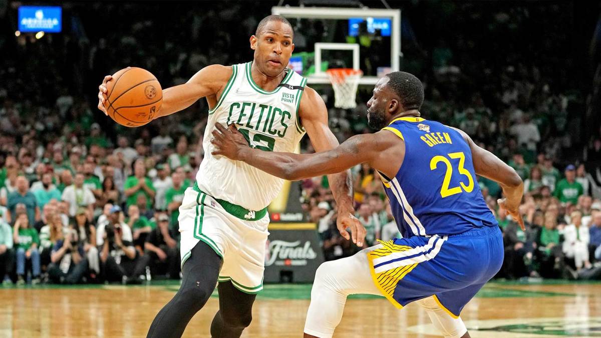 Boston Celtics center Al Horford (42) drives to the basket against Golden State Warriors forward Draymond Green (23) during the fourth quarter in game six of the 2022 NBA Finals at TD Garden.