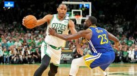 Boston Celtics center Al Horford (42) drives to the basket against Golden State Warriors forward Draymond Green (23) during the fourth quarter in game six of the 2022 NBA Finals at TD Garden.