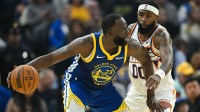 Golden State Warriors forward Draymond Green (23) dribbles against Phoenix Suns forward Royce O'Neale (00) in the first quarter at Chase Center.