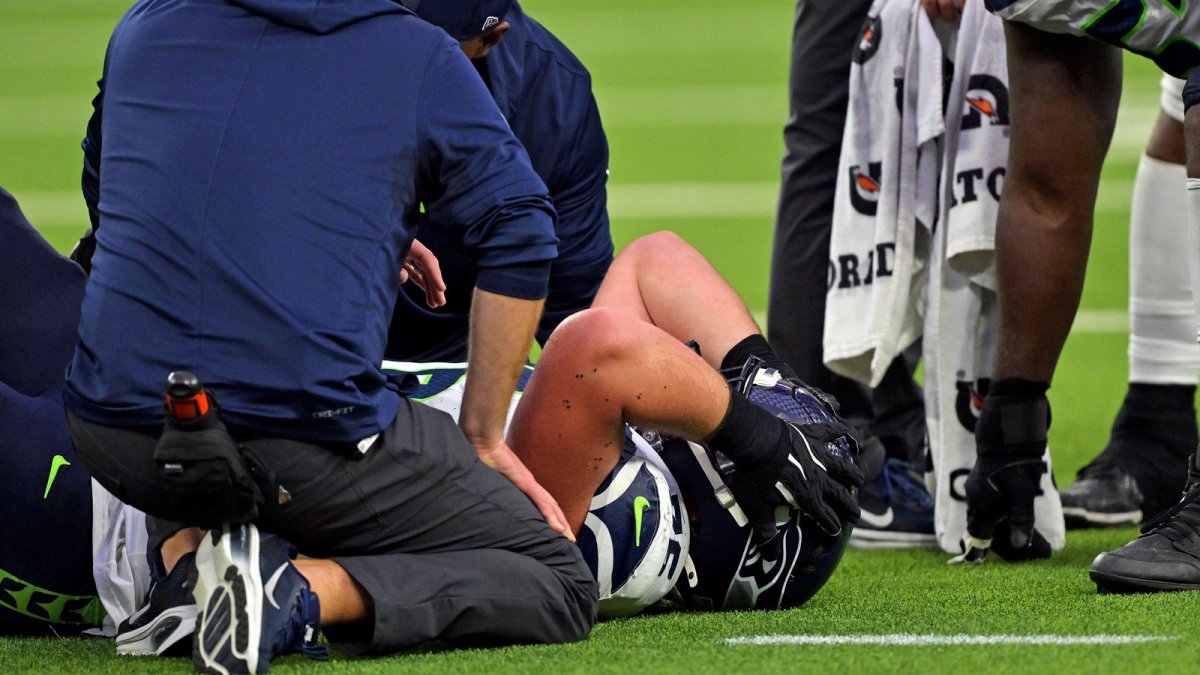 Seattle Seahawks guard Grey Zabel (76) lays on the field injured during the second half against the Los Angeles Rams at SoFi Stadium.