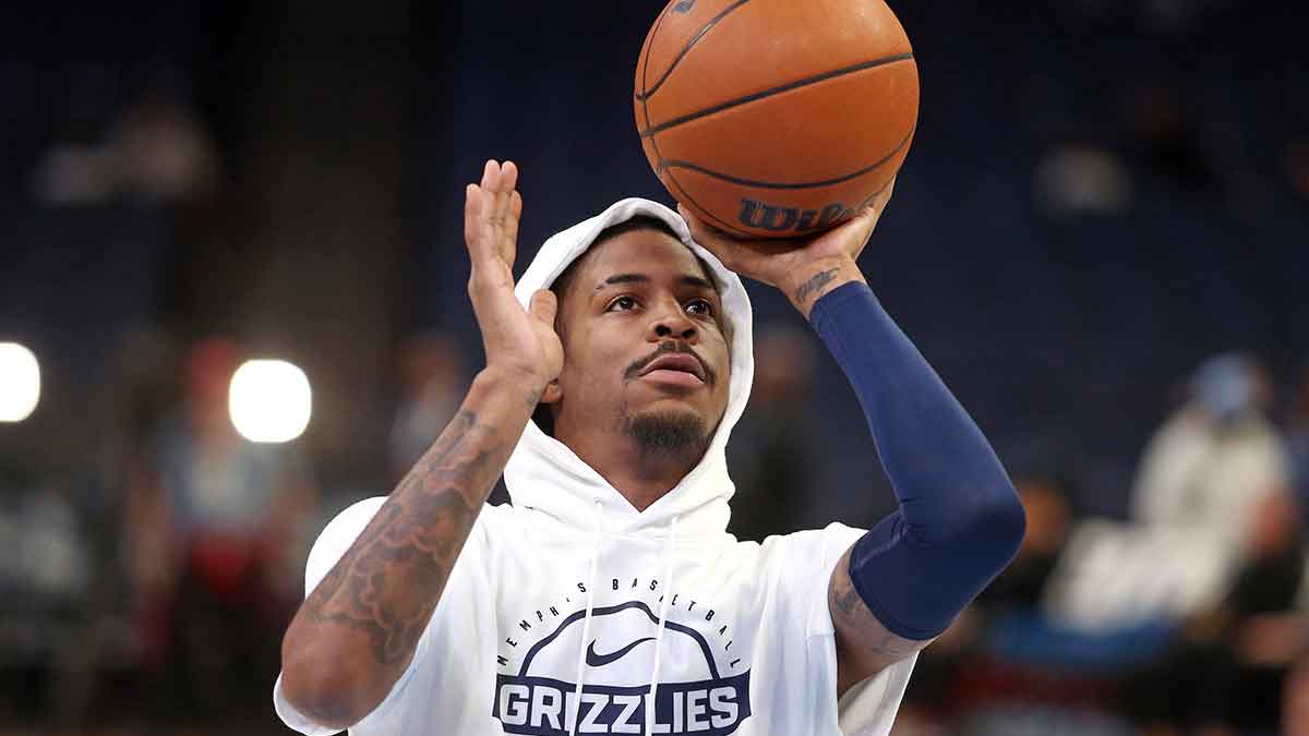 Grizzlies guard Ja Morant (12) shoots during warm ups prior to the game against the Detroit Pistons at FedExForum