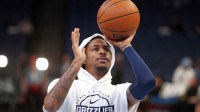 Grizzlies guard Ja Morant (12) shoots during warm ups prior to the game against the Detroit Pistons at FedExForum