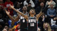 Grizzlies forward/center Jaren Jackson Jr. (8) and guard Ja Morant (12) react during the third quarter against the Oklahoma City Thunder at FedExForum