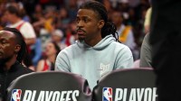 Memphis Grizzlies guard Ja Morant (12) looks on from the bench area during the fourth quarter against the Oklahoma City Thunder during game four for the first round of the 2024 NBA Playoffs at FedExForum.