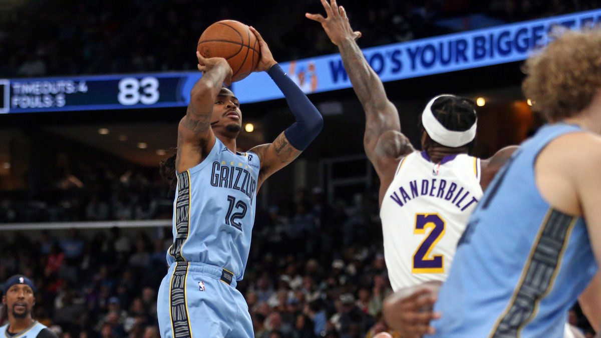 Memphis Grizzlies guard Ja Morant (12) shoots as Los Angeles Lakers forward Jarred Vanderbilt (2) defends during the third quarter at FedExForum.