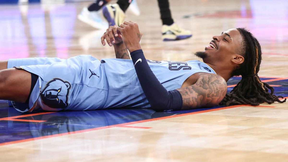 Memphis Grizzlies guard Ja Morant (12) lays on the court after attempting to score in the third quarter against the New York Knicks at Madison Square Garden