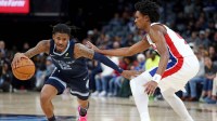 Memphis Grizzlies guard Ja Morant (12) drives to the basket as Detroit Pistons guard Ausar Thompson (9) defends during the third quarter at FedExForum.
