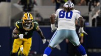 Green Bay Packers defensive end Micah Parsons (1) rushes past the block of Dallas Cowboys offensive tackle Tyler Guyton (60) during the game between the Dallas Cowboys and the Green Bay Packers at AT&T Stadium