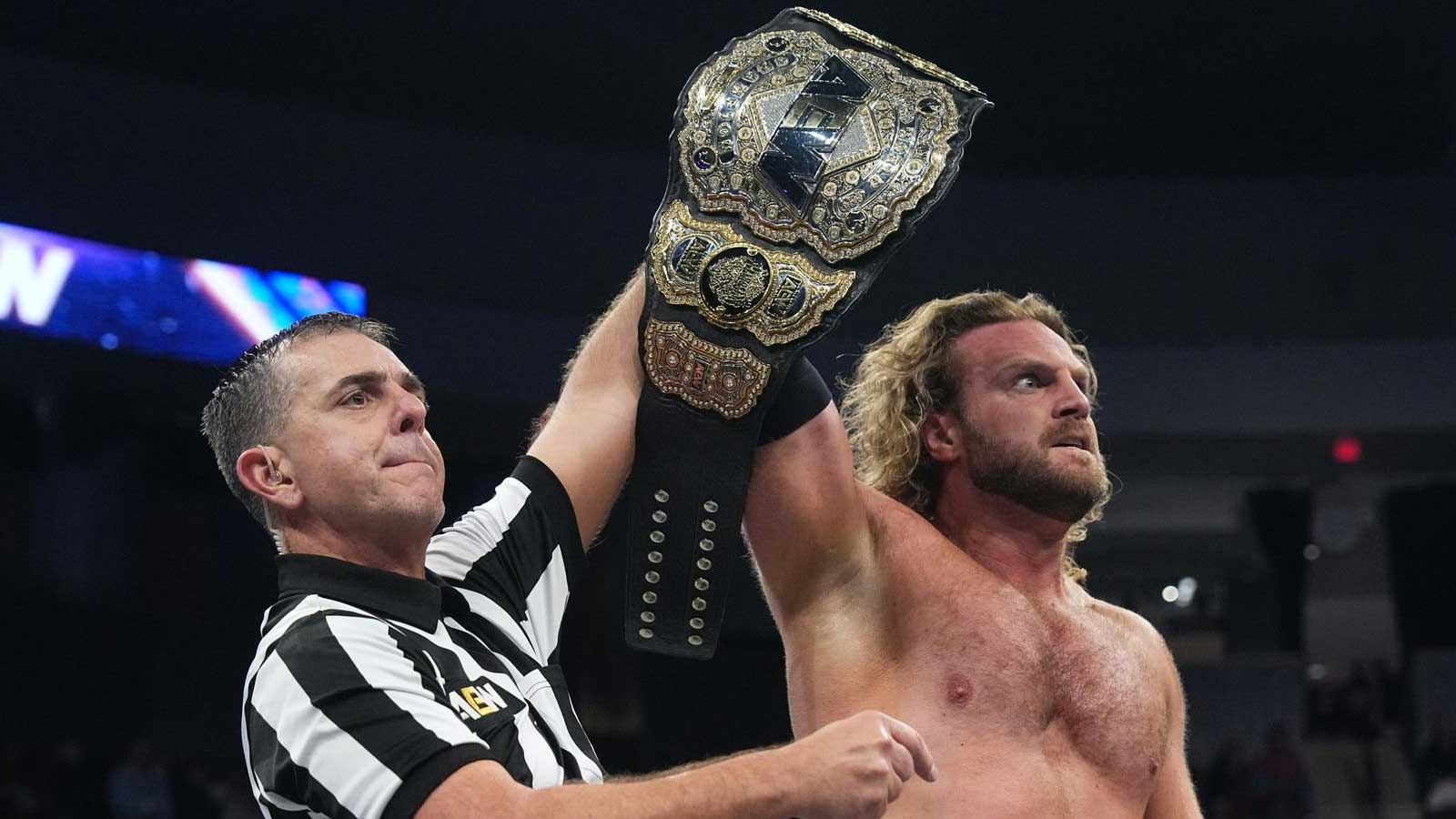 AEW World Champion Hangman Adam Page with his championship belt.