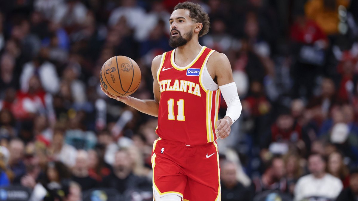 Hawks guard Trae Young (11) brings the ball up court against the Chicago Bulls during the second half at United Center