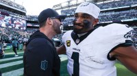 Philadelphia Eagles quarterback Jalen Hurts (1) and head coach Nick Sirianni celebrate after a victory against the Los Angeles Rams at Lincoln Financial Field.