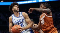 Duke Blue Devils forward Cameron Boozer (12) battles for position against Texas Longhorns forward Nic Codie (10) during the first quarter at the Dick Vitale’s Invitational game at Spectrum Center.