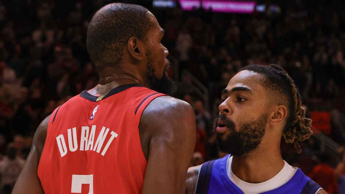 Houston Rockets forward Kevin Durant (7) hugs Dallas Mavericks guard D'Angelo Russell (5) after the game at Toyota Center.