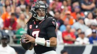 Houston Texans quarterback C.J. Stroud (7) drops to throw during the first half against the Denver Broncos at NRG Stadium.