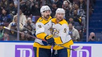 Nashville Predators forward Filip Forsberg (9) and forward Steven Stamkos (91) celebrate Stamkos’ second goal against the Vancouver Canucks during the second period at Rogers Arena.
