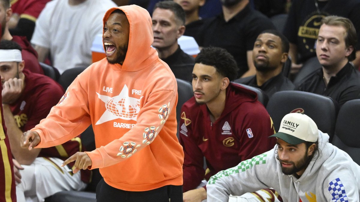 Cleveland Cavaliers guard Darius Garland (left) celebrates near the bench in the fourth quarter against the Memphis Grizzlies at Rocket Arena.