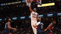 Cleveland Cavaliers center Jarrett Allen (31) dunks the ball as Washington Wizards forward Justin Champagnie (9) looks on in the second half in an Emirates NBA Cup game at Capital One Arena.