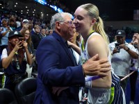 University of Connecticut head coach Geno Auriemma hugs Dallas Wings guard Paige Bueckers (5) after the game against the Golden State Valkyries at College Park Center.