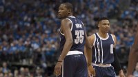 Oklahoma City Thunder forward Kevin Durant (35) and guard Russell Westbrook (0) celebrate during the second half against the Dallas Mavericks in game three of the first round of the NBA Playoffs at American Airlines Center. The Thunder defeated the Mavericks 131-102.