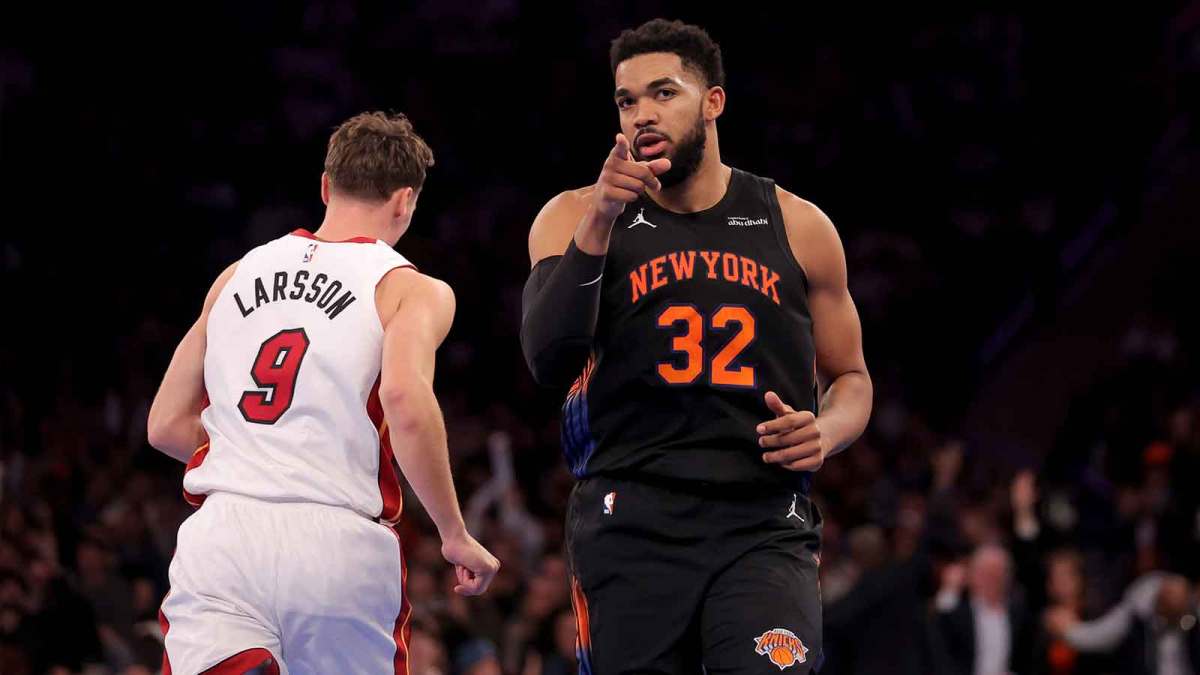 New York Knicks center Karl-Anthony Towns (32) reacts after a three point shot against Miami Heat guard Pelle Larsson (9) during the second quarter at Madison Square Garden.