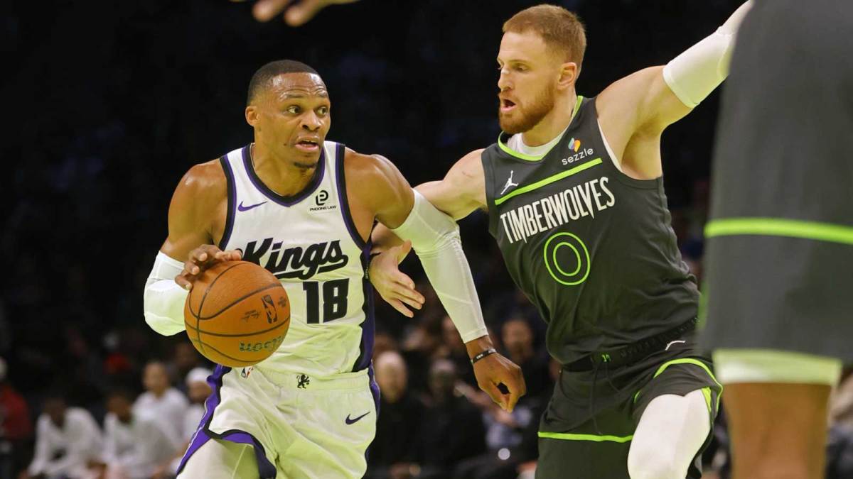 Sacramento Kings guard Russell Westbrook (18) works around Minnesota Timberwolves guard Donte DiVincenzo (0) in the third quarter at Target Center.
