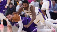 Los Angeles Lakers guard Marcus Smart (36) and Utah Jazz center Jusuf Nurkic (30) goes for a loose ball during the second quarter at Delta Center.