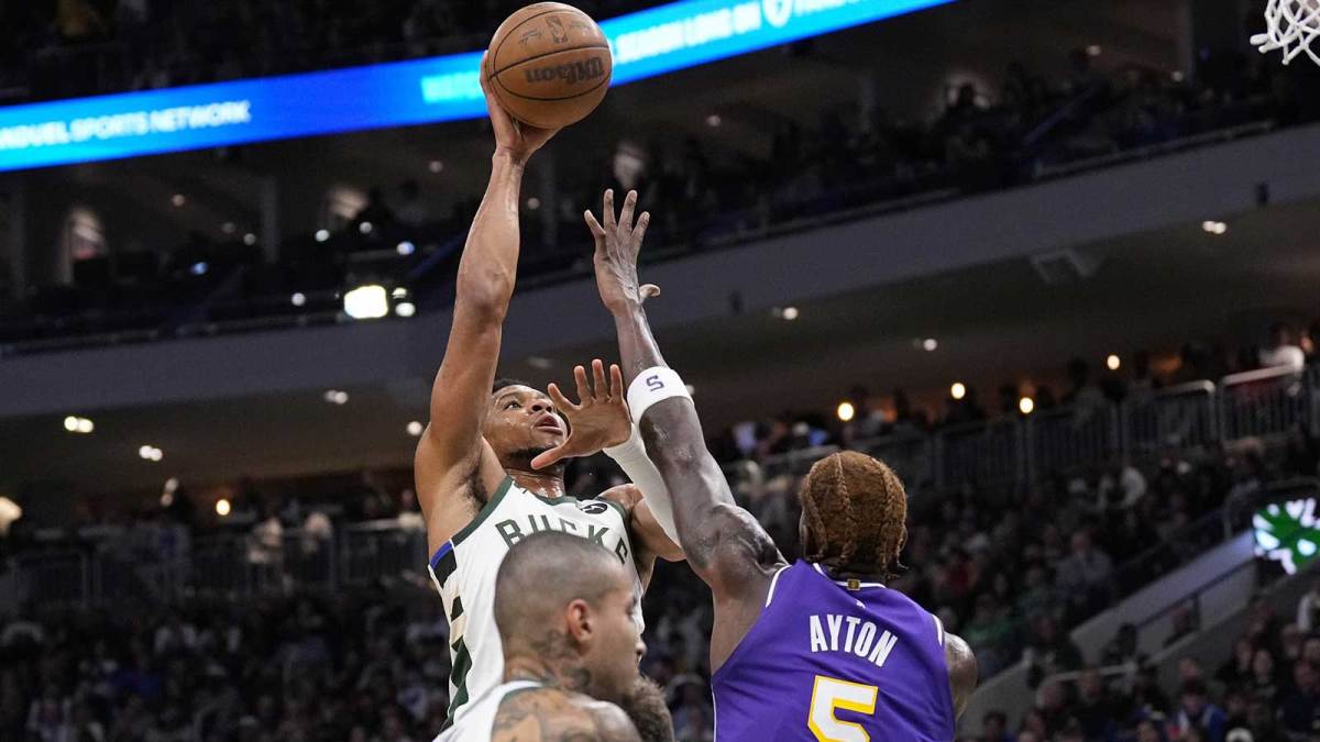 Milwaukee Bucks forward Giannis Antetokounmpo (34) shoots against Los Angeles Lakers center Deandre Ayton (5) during the first quarter at Fiserv Forum.