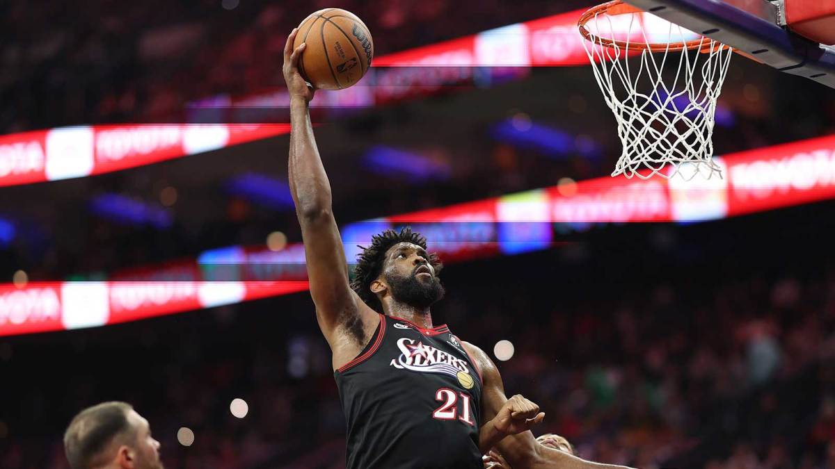 Philadelphia 76ers center Joel Embiid (21) drives for a shot against Toronto Raptors forward Scottie Barnes (4) during the second quarter at Xfinity Mobile Arena.