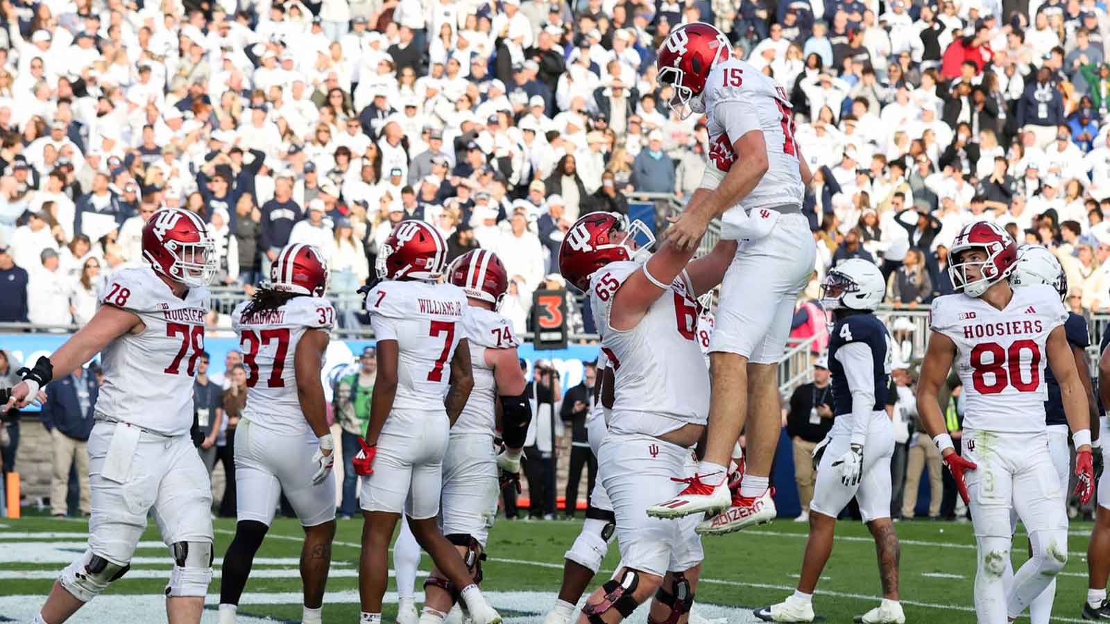 Indiana Hoosiers quarterback Fernando Mendoza (15) is lifted into the air after throwing a touchdown pass to wide receiver Omar Cooper Jr. (3) (not pictured) during the fourth quarter against the Penn State Nittany Lions at Beaver Stadium.