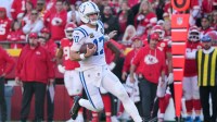 Indianapolis Colts quarterback Daniel Jones (17) runs against the Kansas City Chiefs in the second half at GEHA Field at Arrowhead Stadium.