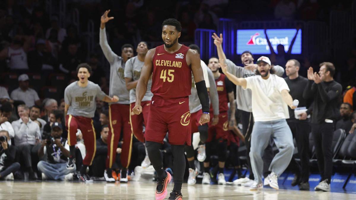 Cleveland Cavaliers guard Donovan Mitchell (45) and the Cavaliers bench react against the Miami Heat during the second half at Kaseya Center.