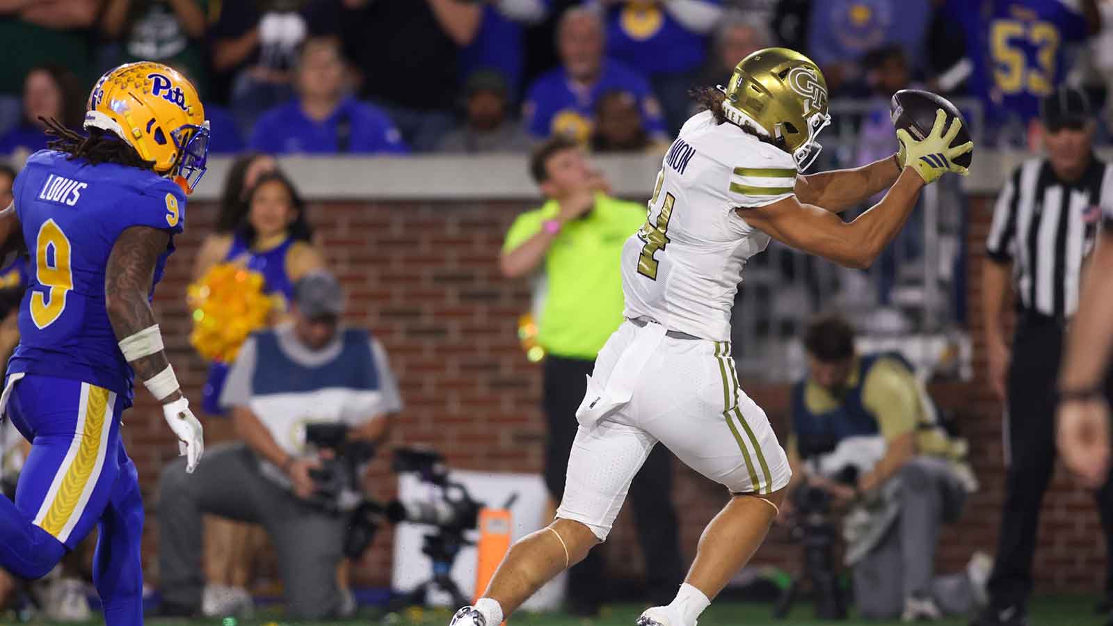 Georgia Tech Yellow Jackets wide receiver Isiah Canion (4) catches a pass for a touchdown against the Pittsburgh Panthers in the second quarter at Bobby Dodd Stadium at Hyundai Field. 