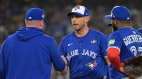 Toronto Blue Jays manager John Schneider (14) relieves pitcher Max Scherzer (31) in the fifth inning against the Los Angeles Dodgers during game three of the 2025 MLB World Series at Dodger Stadium.