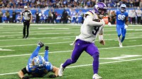 Michigan, USA; Minnesota Vikings quarterback J.J. McCarthy (9) runs the ball for a touchdown in the third quarter against the Detroit Lions at Ford Field.