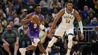 Los Angeles Lakers guard Bronny James Jr. (9) passes the ball away during the first quarter against the Milwaukee Bucks at Fiserv Forum.