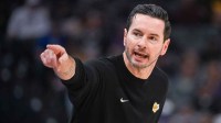 Los Angeles Lakers head coach JJ Redick makes a call to the bench during the first quarter of the game against the Sacramento Kings at Golden 1 Center.