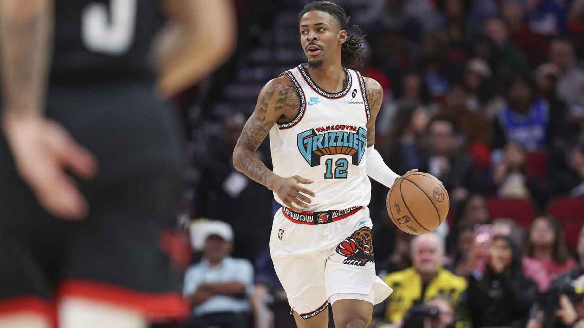 Memphis Grizzlies guard Ja Morant (12) dribbles the ball during the first quarter against the Houston Rockets at Toyota Center.