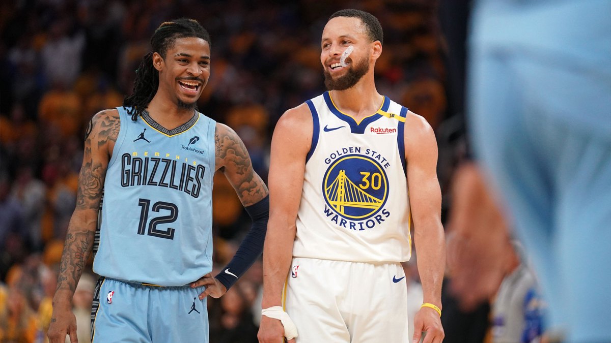 Memphis Grizzlies guard Ja Morant (12) talks with Golden State Warriors guard Stephen Curry (30) in between free throw by Curry in the fourth quarter at the Chase Center.