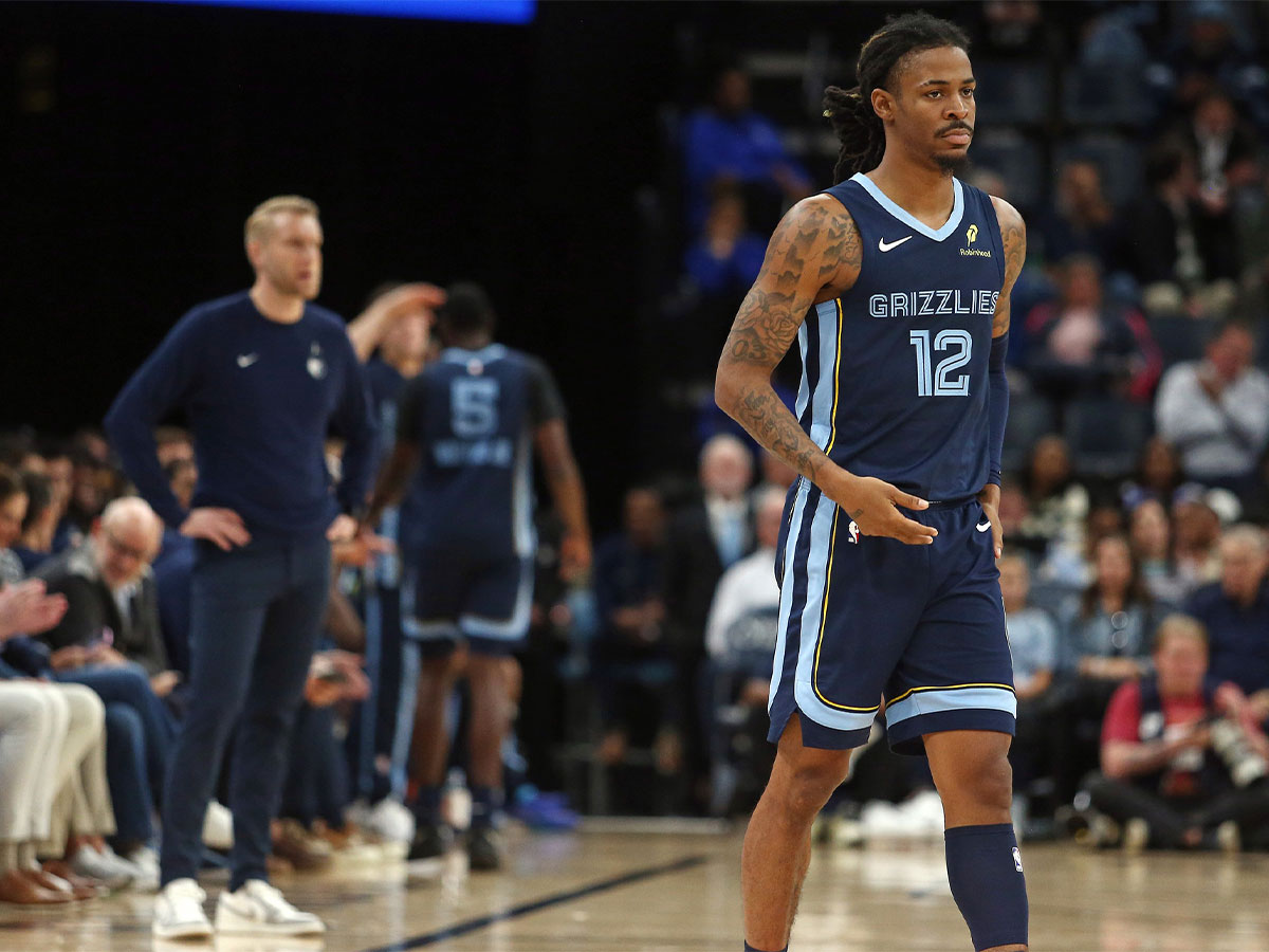 Memphis Grizzlies guard Ja Morant (12) checks into the game during the second quarter against the Detroit Pistons at FedExForum.