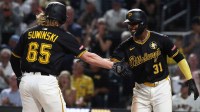 Pittsburgh Pirates shortstop Liover Peguero (31) greets right fielder Jack Suwinski (65) crossing home plate on a two-run home run against the San Francisco Giants during the seventh inning at PNC Park.
