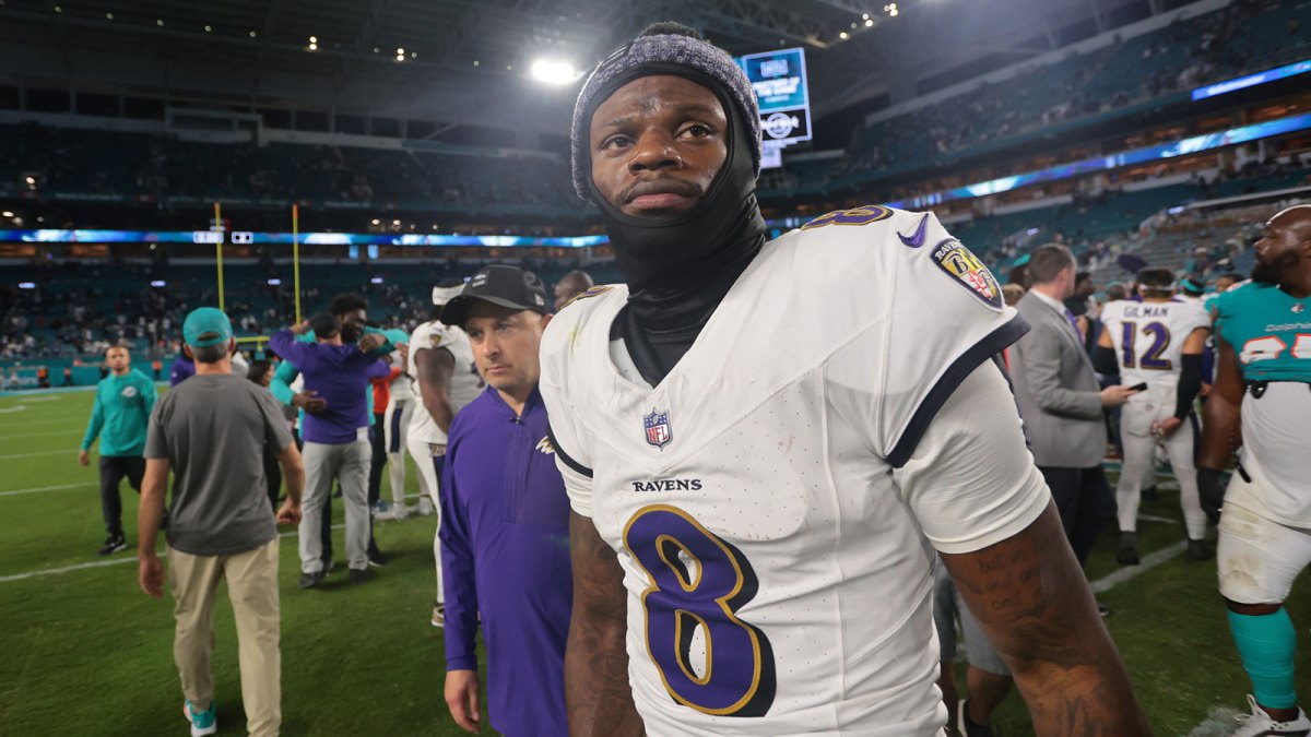 Baltimore Ravens quarterback Lamar Jackson (8) walks off the field after a win over Miami Dolphins at Hard Rock Stadium.