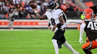Baltimore Ravens quarterback Lamar Jackson (8) throws downfield during the first quarter against the Cleveland Browns at Huntington Bank Field