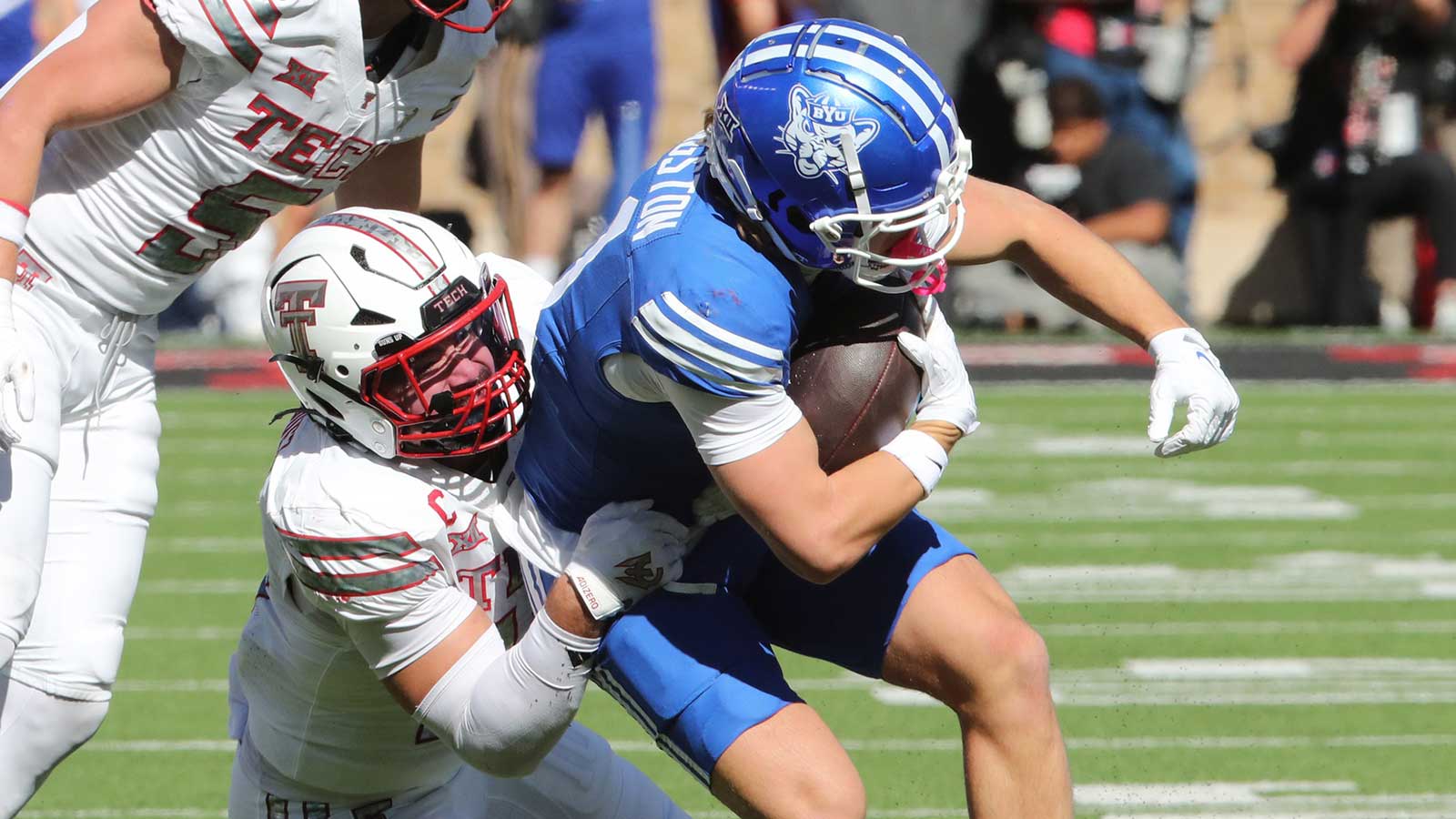 Brigham Young Cougars wide receiver parker Kingston (11) is tackled by Texas Tech Red Raiders defensive back Jacob Rodriguez (10) in the first half at Jones AT&T Stadium.