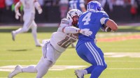 Texas Tech's Jacob Rodriguez tackles BYU running back LJ Martin during a Big 12 Conference football game, Saturday, Nov. 8, 2025, at Jones AT&T Stadium.