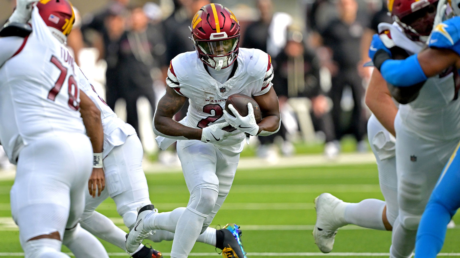 Washington Commanders running back Jacory Croskey-Merritt (22) runs for a touchdown against the Los Angeles Chargers in the second half at SoFi Stadium.