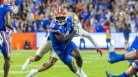 Florida Gators running back Jadan Baugh (13) runs the ball during the second quarter against the Florida State Seminoles at Ben Hill Griffin Stadium.