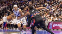 Detroit Pistons guard Jaden Ivey (23) defends against Orlando Magic guard Anthony Black (0) during the first quarter at Little Caesars Arena.